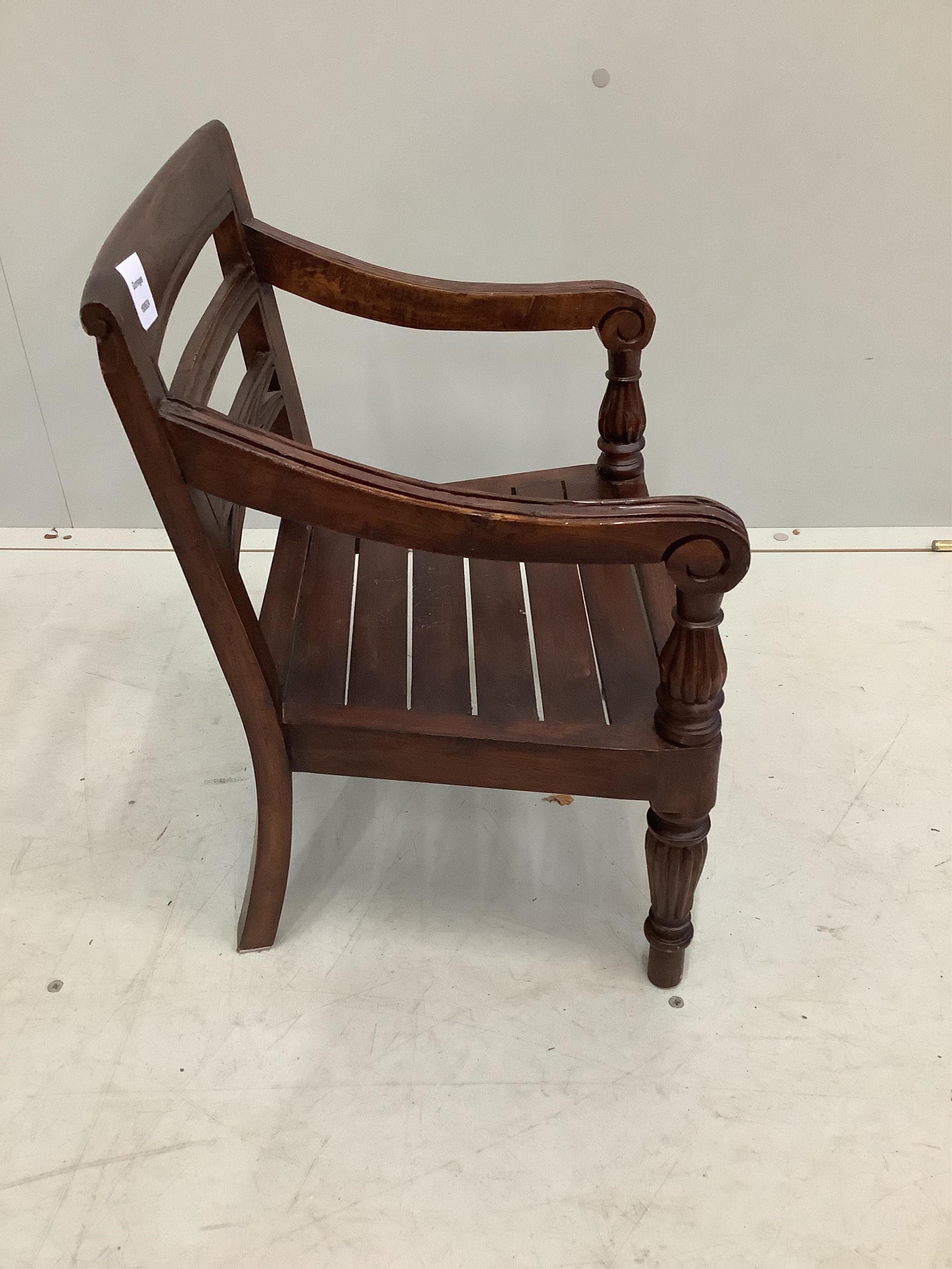 A reproduction hardwood child's chair, height 50cm. Condition - fair